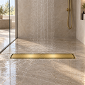 Rejilla invisible Oro cepillado instalada en ducha